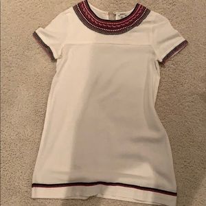 White dress with pink and black detailing